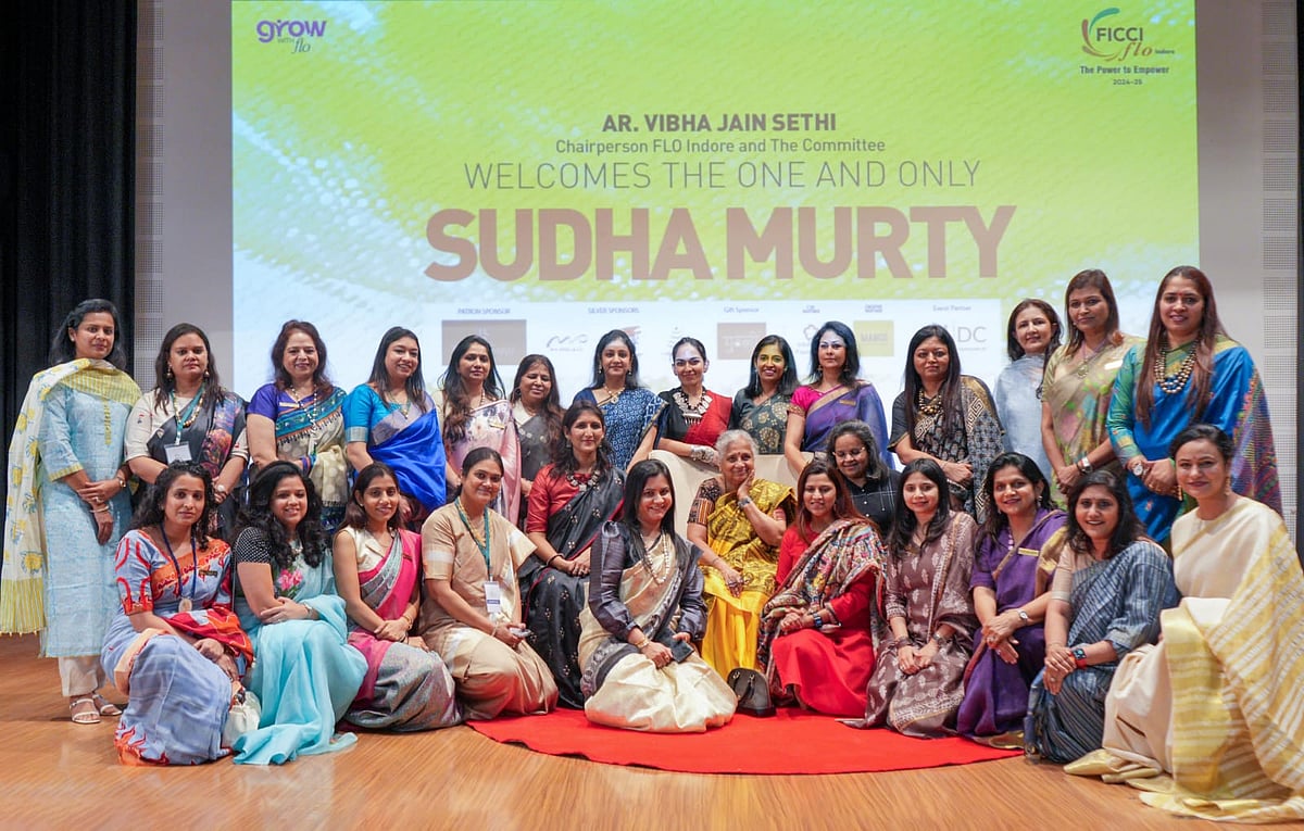 FICCI Flo members pose with Sudha Murty, capturing a memorable moment from the event